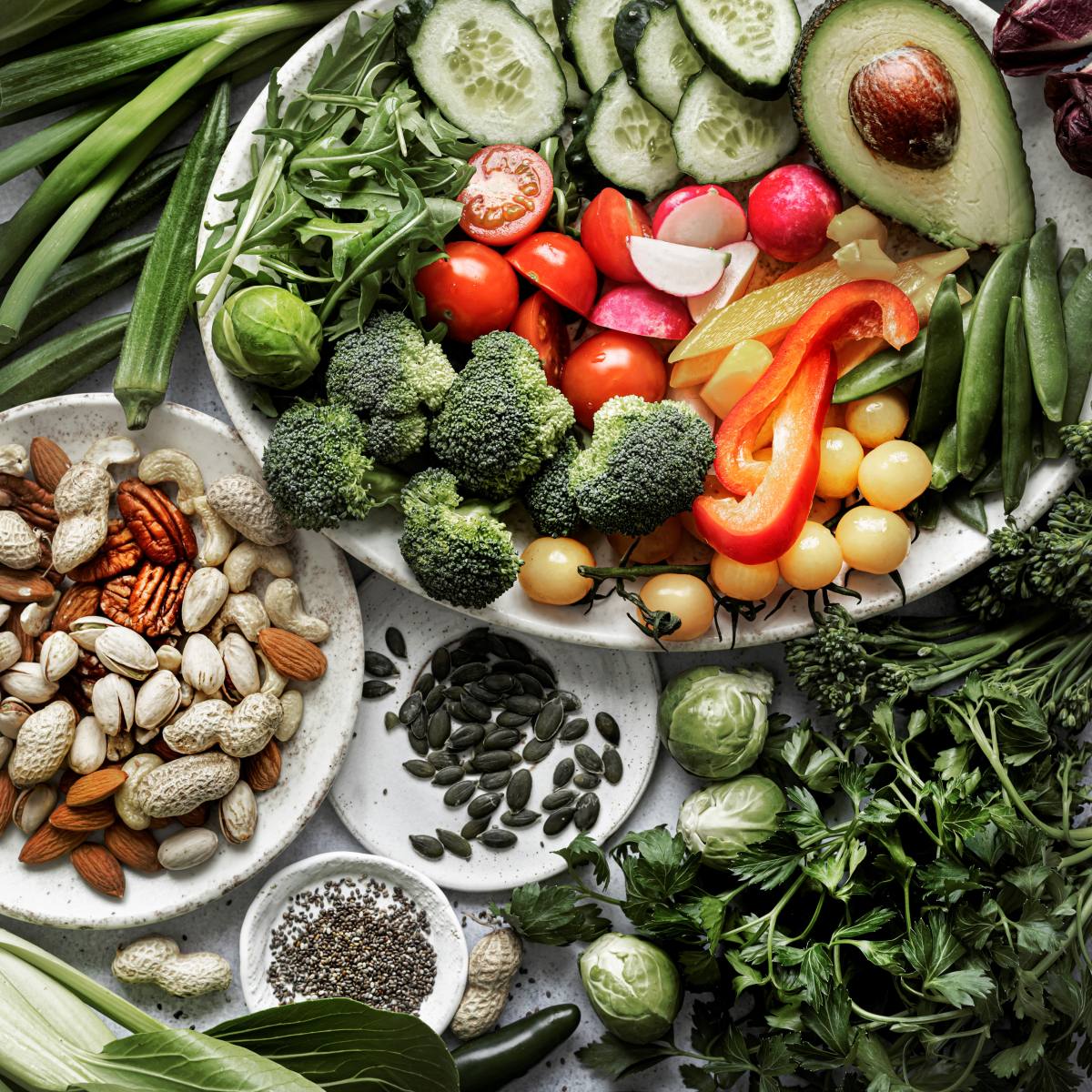 Selection of fresh vegetables, seeds and nutrient rich superfoods