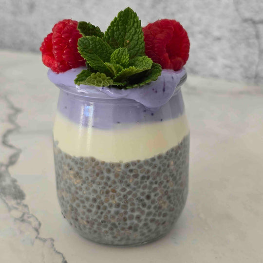 Butterfly Pea Powder used to create a naturally purple chia pudding with raspberries and mint