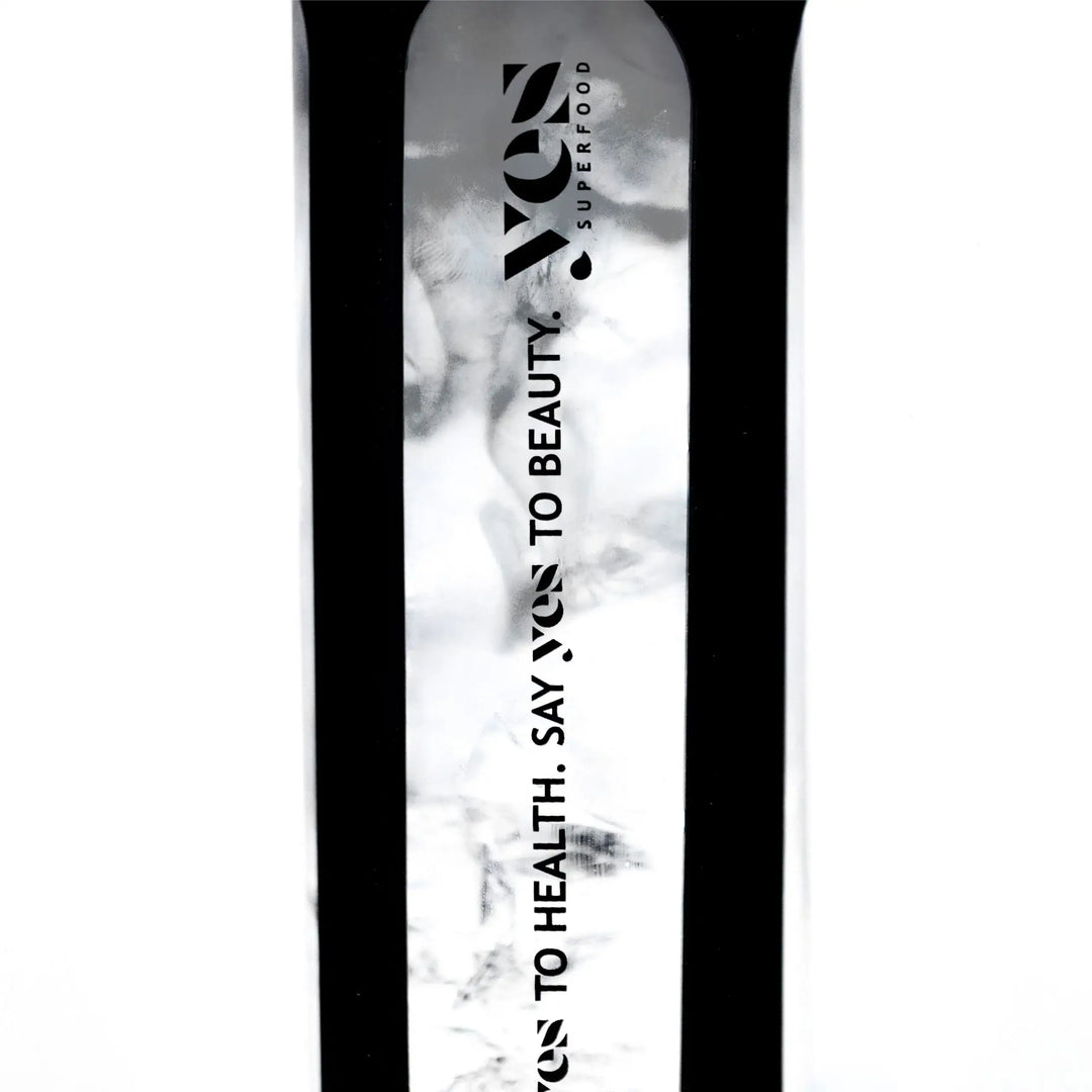 Yes Superfood Glass Shaker filled with a black drink