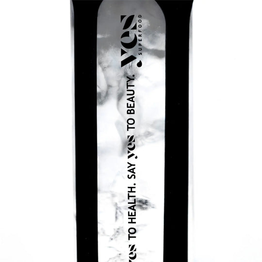Yes Superfood Glass Shaker filled with a black drink